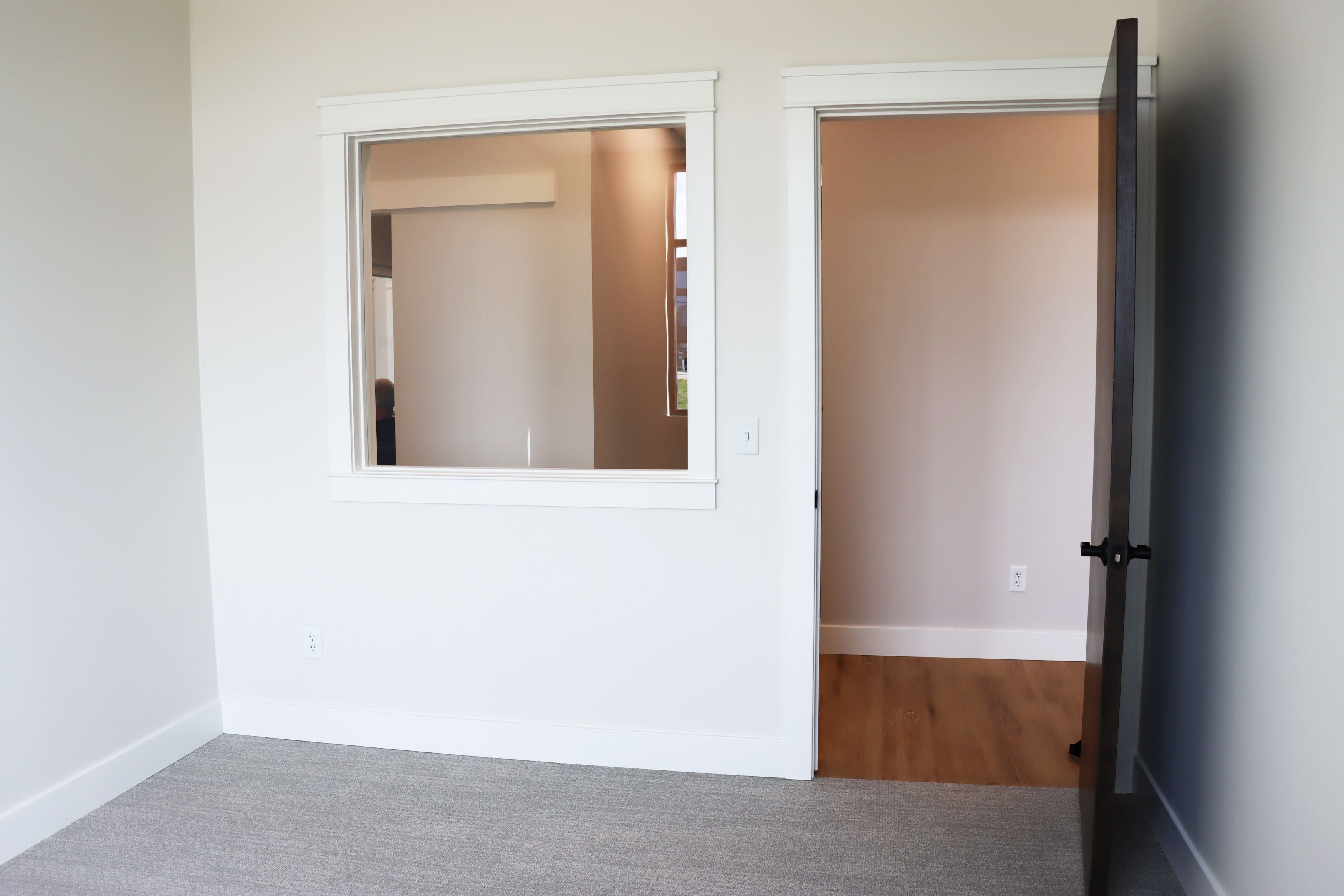 Interior of commercial office building showing private office and interior window, constructed by Rice Companies