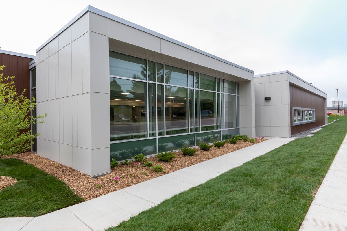 Exterior of medical clinic showing storefront windows and landscaped entry, constructed by Rice Companies