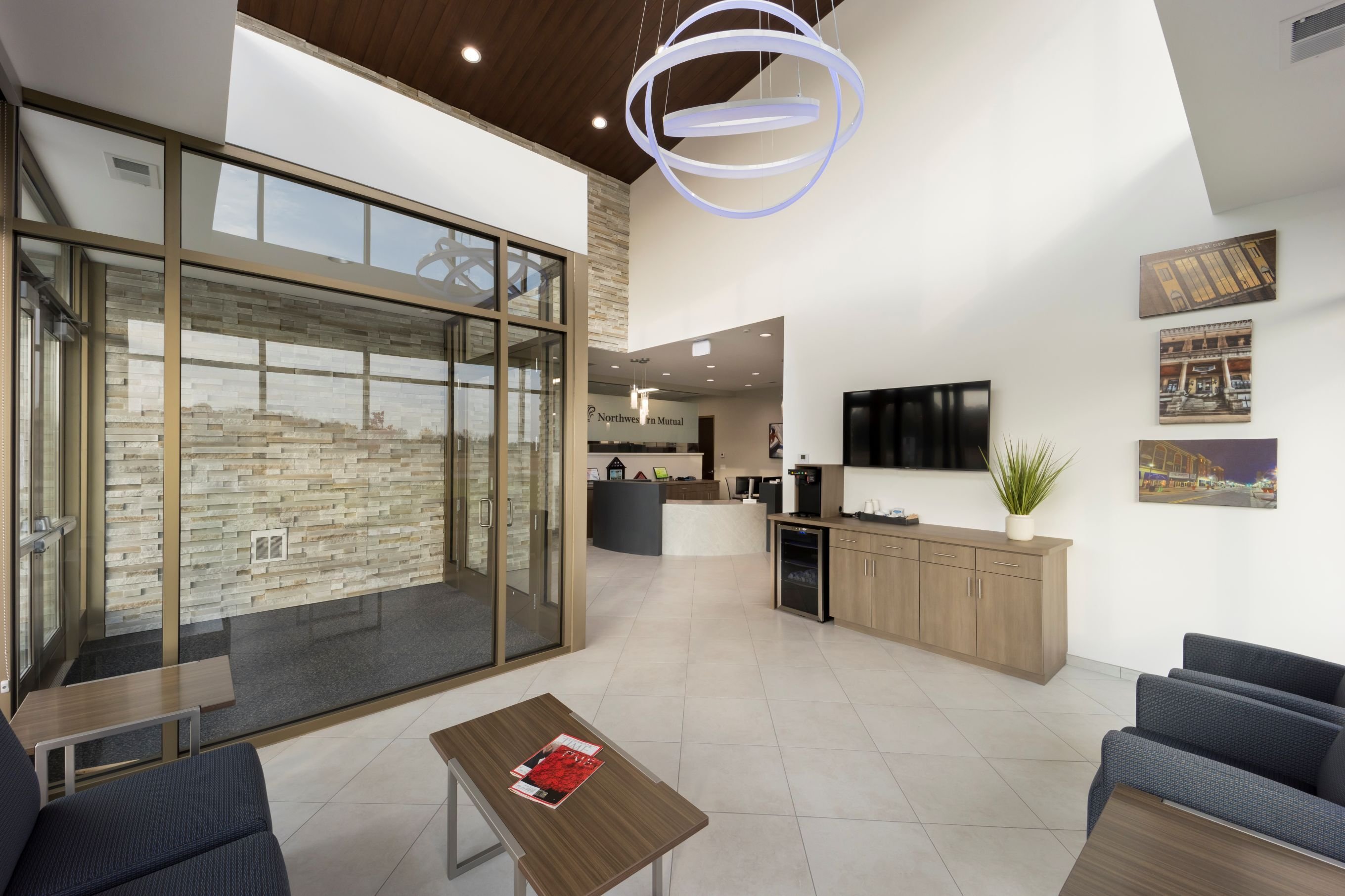 Interior of corporate office showing reception area and glass conference room, constructed by Rice Companies