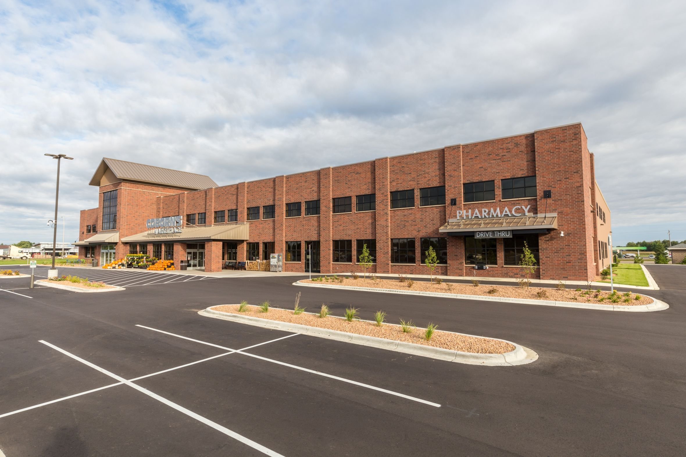 Exterior view of Coborn’s Marketplace showing pharmacy entrance and brick façade constructed by Rice Companies