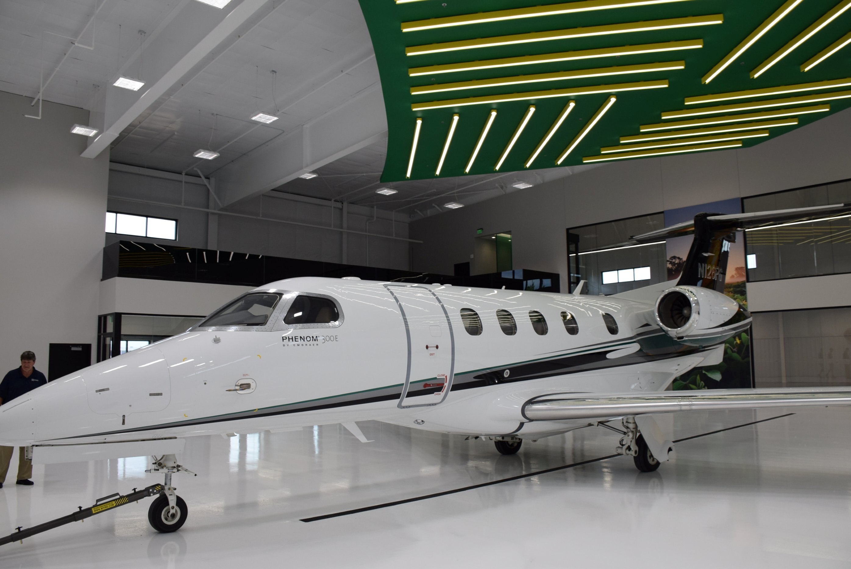 Interior of aircraft hangar facility showing private jet storage area, constructed by Rice Companies
