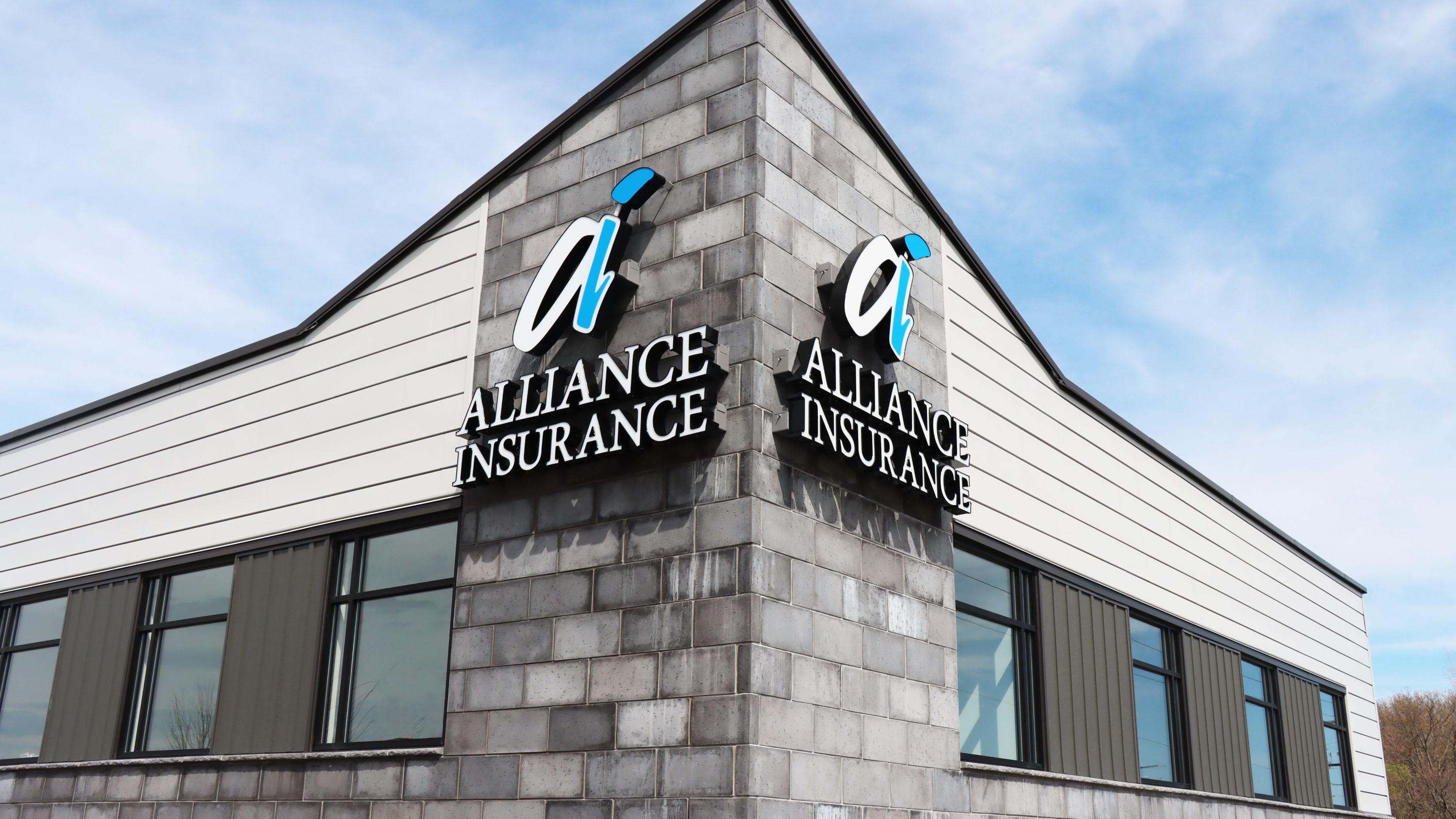 Exterior of commercial office building showing branded facade and entry, constructed by Rice Companies