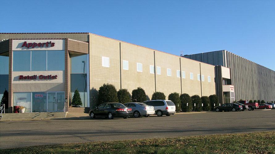 Exterior of cold storage and distribution facility showing building facade and site access, constructed by Rice Companies