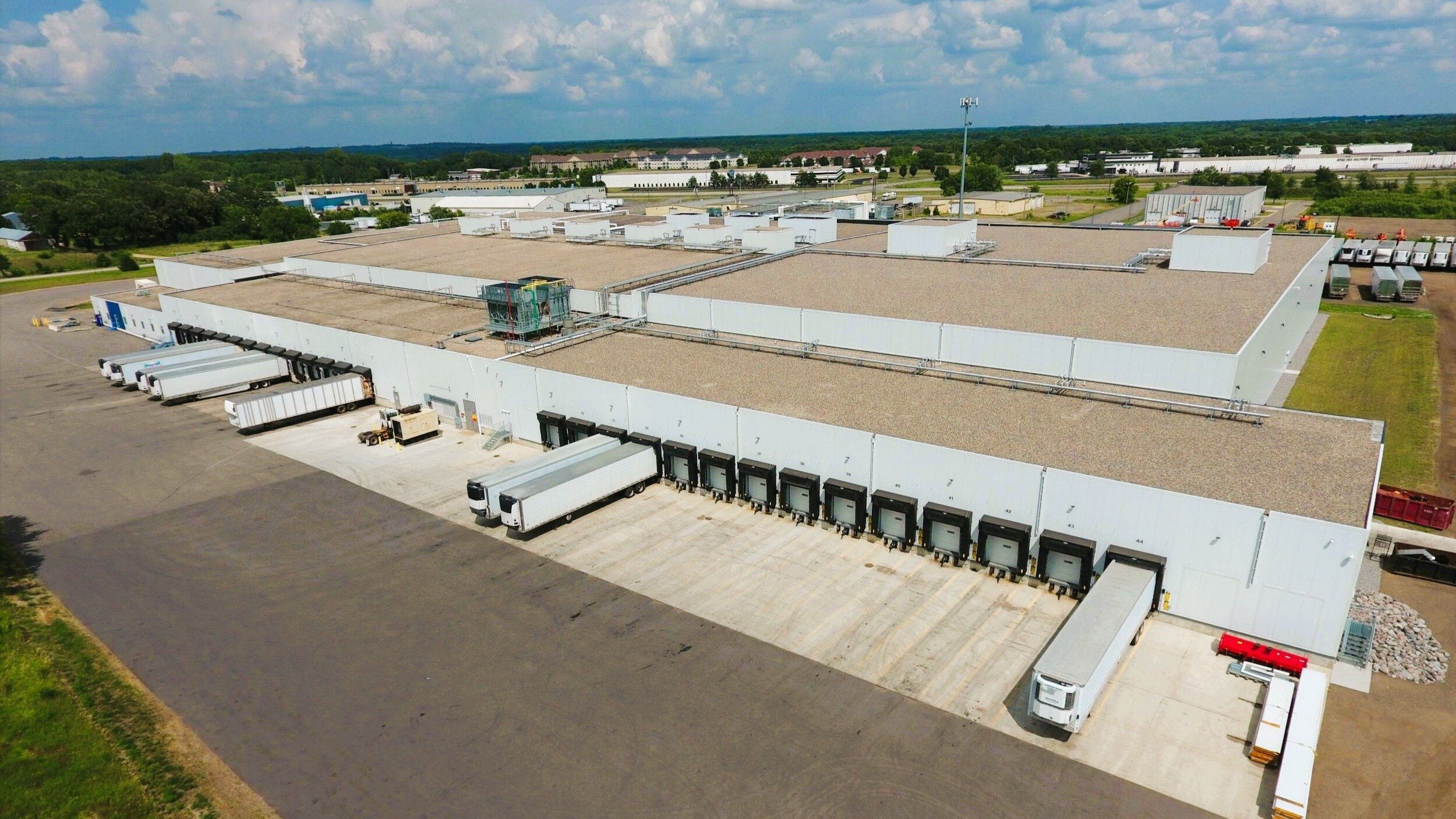 Exterior of cold storage and distribution facility showing loading docks and truck access, constructed by Rice Companies