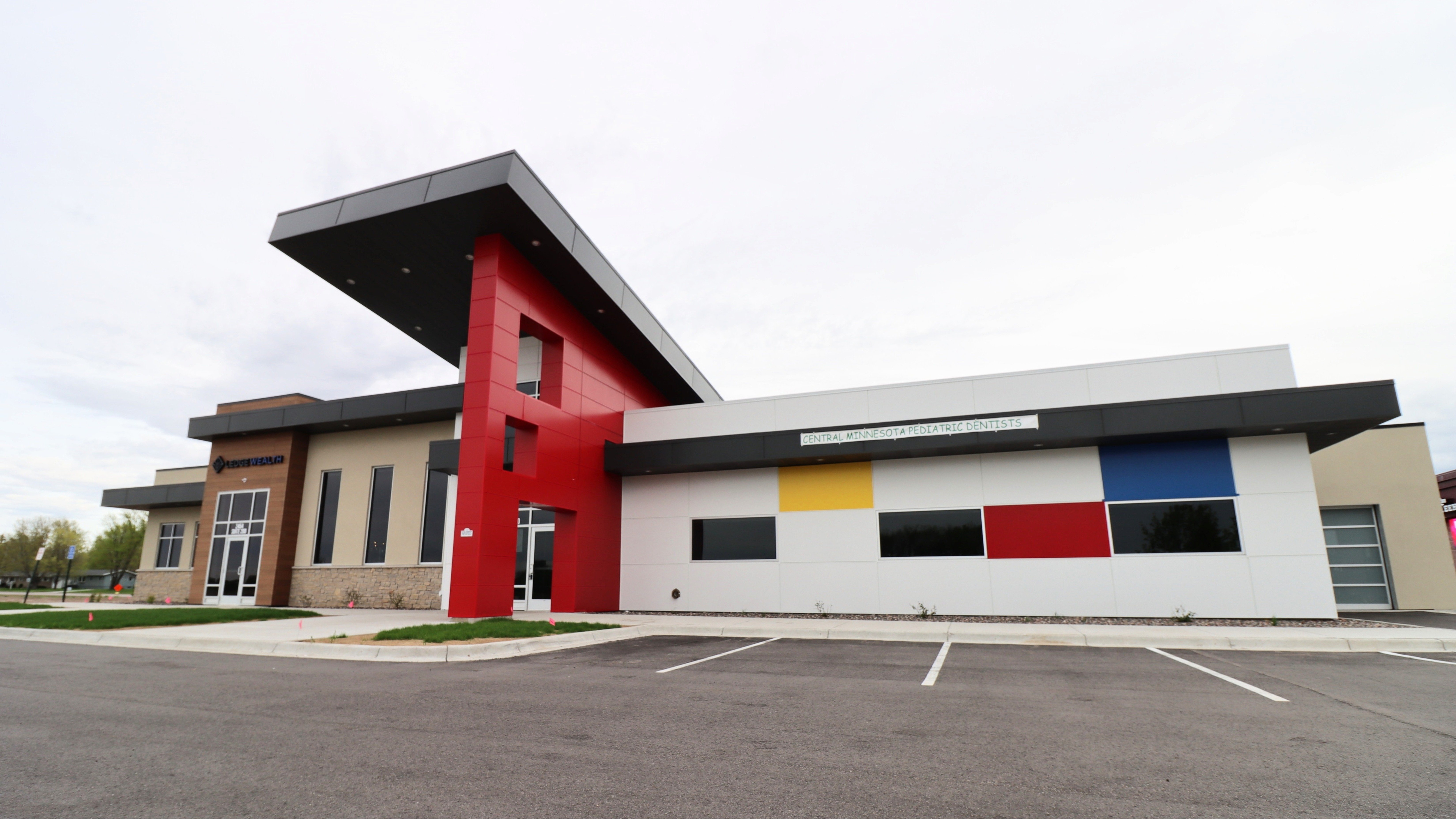 Exterior of pediatric dental clinic showing modern facade and main entrance, constructed by Rice Companies