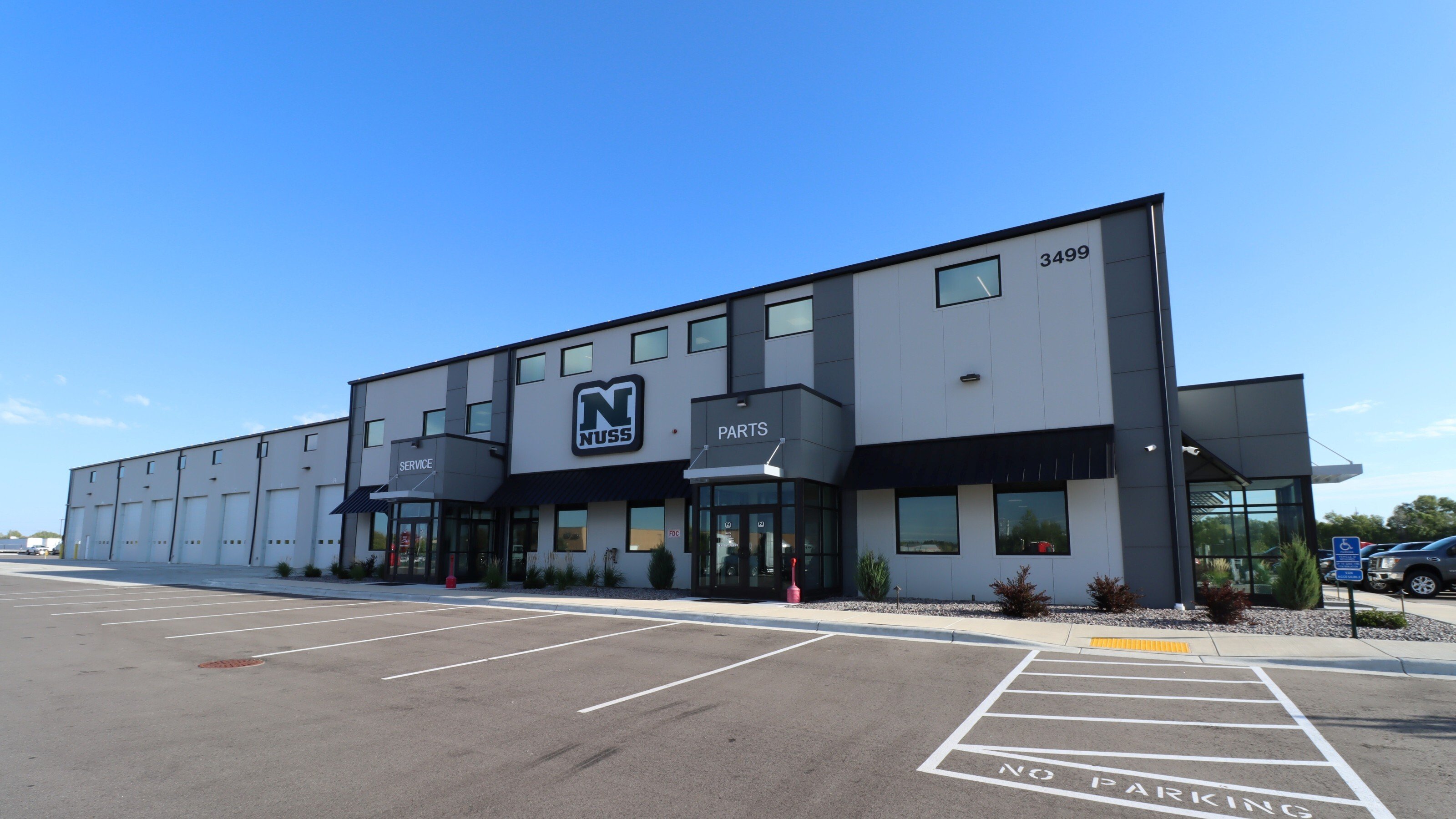 Exterior of commercial service facility showing service bays and main entrance, constructed by Rice Companies